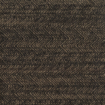 Herringbone fabric sample in dark brown and tan tones, featuring a dense, nubby weave with angled lines and a matte finish.
